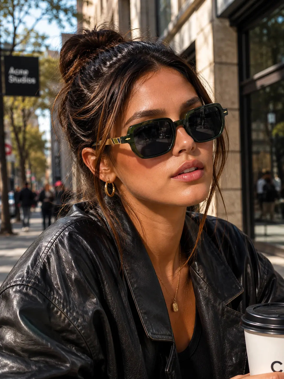 Model wearing Betty’s Retro Shades Beatrice sunglasses in clear green