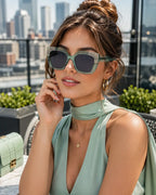 Model wearing Betty’s Retro Shades Bunny sunglasses in clear green
