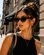 Model wearing Betty’s Retro Shades Carlotta sunglasses in marbled black