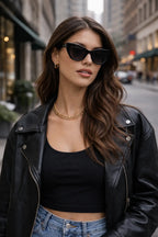 Model wearing Betty’s Retro Shades Celeste sunglasses in black