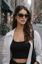 Model wearing Betty’s Retro Shades Clara sunglasses in clear grey