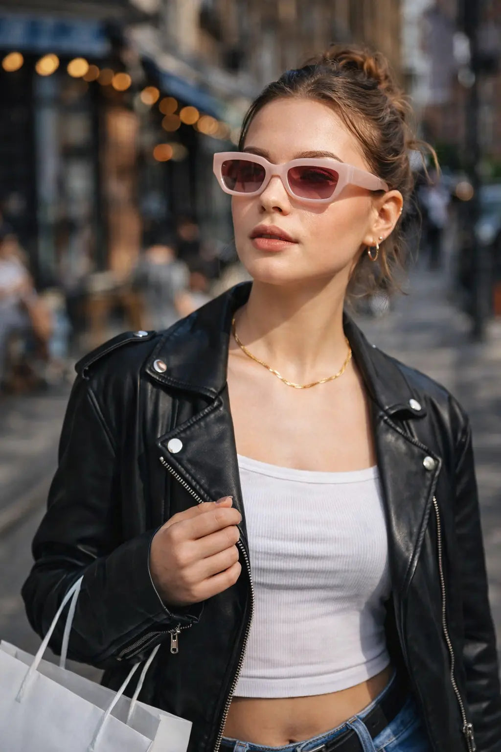 Model wearing Betty’s Retro Shades Cleo sunglasses in pink