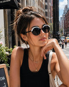 Model wearing Betty’s Retro Shades Dotty sunglasses in marbled black