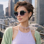 Model wearing Betty’s Retro Shades Dotty sunglasses in marbled purple