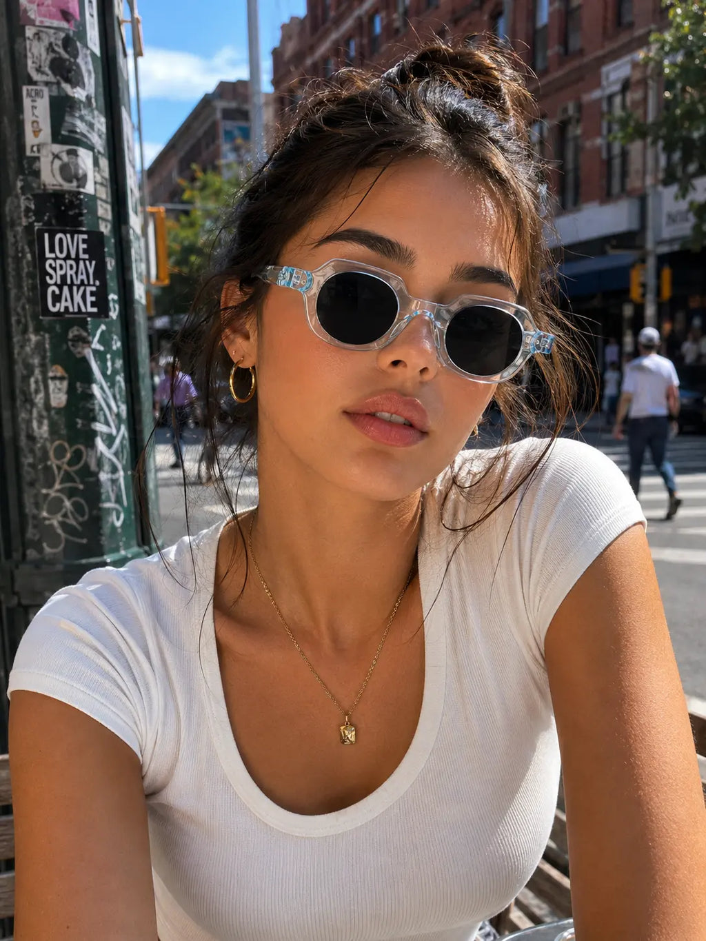Model wearing Betty’s Retro Shades Edna sunglasses in clear blue
