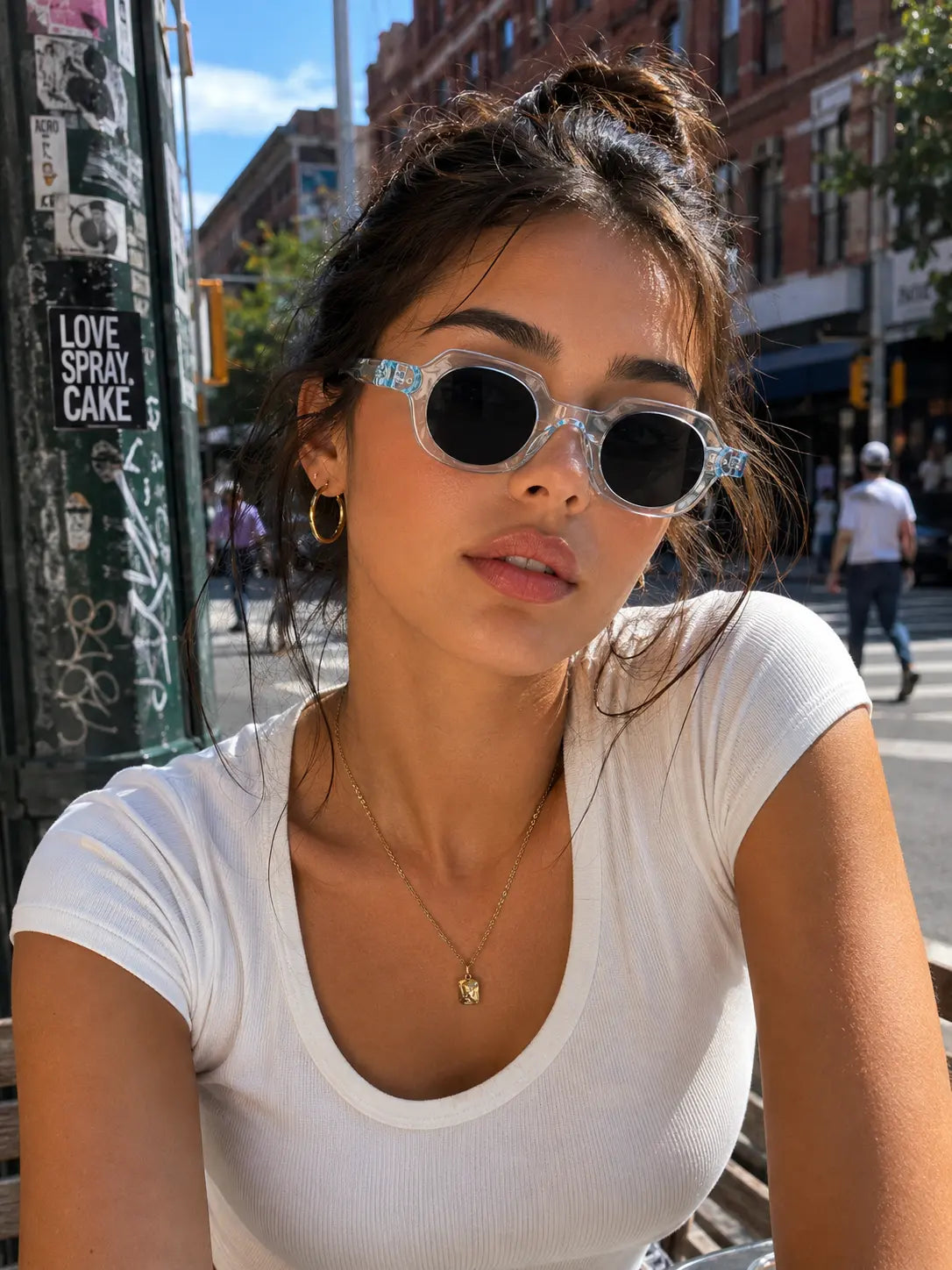Model wearing Betty’s Retro Shades Edna sunglasses in clear blue