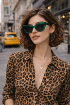Model wearing Betty’s Retro Shades Faye sunglasses in clear green