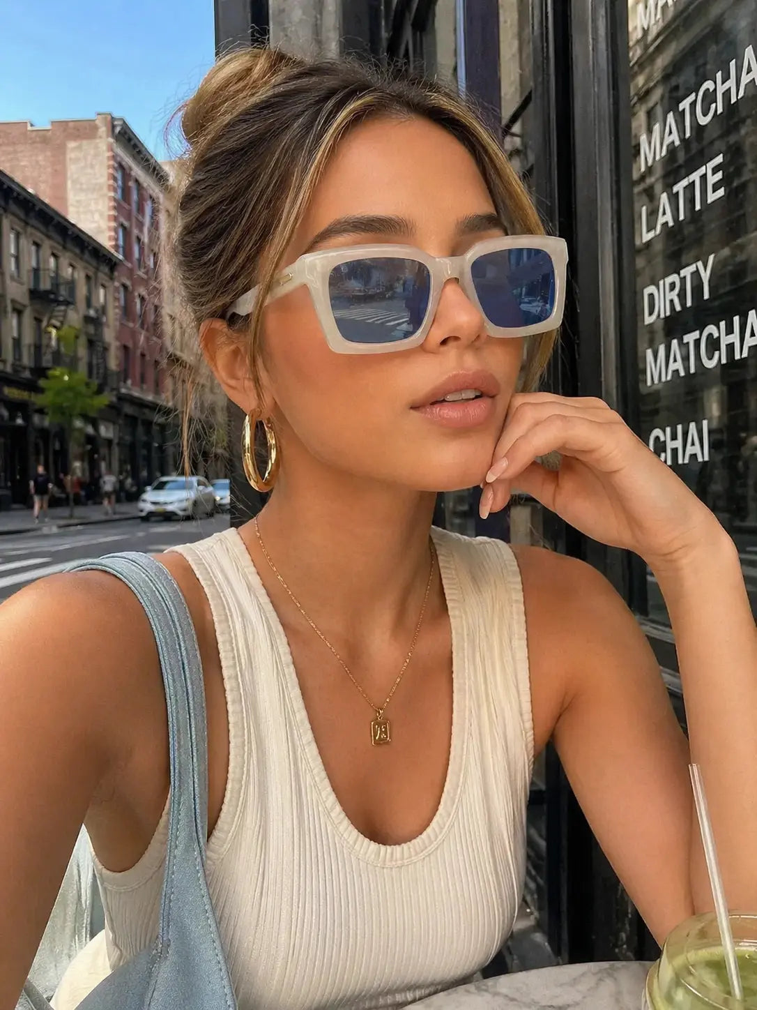 Model wearing Betty’s Retro Shades Frankie sunglasses in white