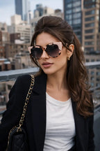 Model wearing Betty’s Retro Shades Marilyn sunglasses in marbled pink
