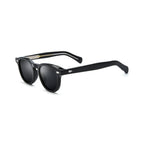 Betty’s Retro Shades Iris sunglasses in black with dark grey lenses