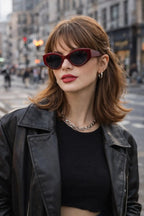 Model wearing Betty’s Retro Shades Loretta sunglasses in wine red