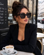 Model wearing Betty’s Retro Shades Magnolia sunglasses in black