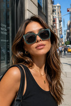 Model wearing Betty’s Retro Shades Magnolia sunglasses in clear green