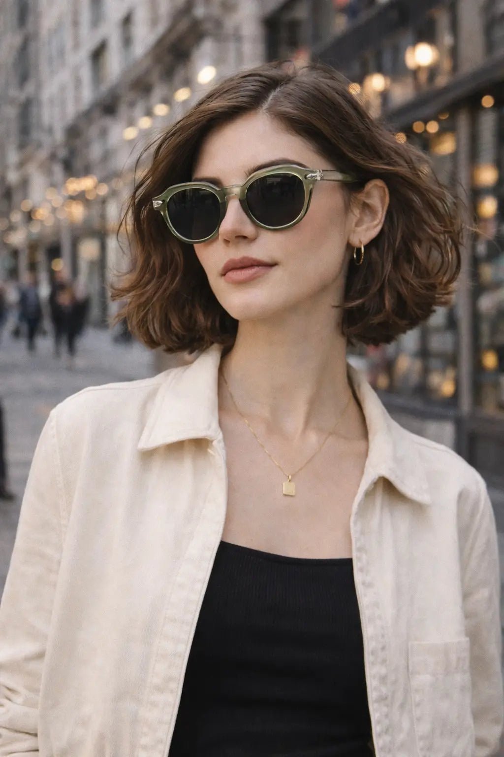Model wearing Betty’s Retro Shades Mitzi sunglasses in clear green