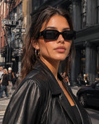 Model wearing Betty’s Retro Shades Penelope sunglasses in black