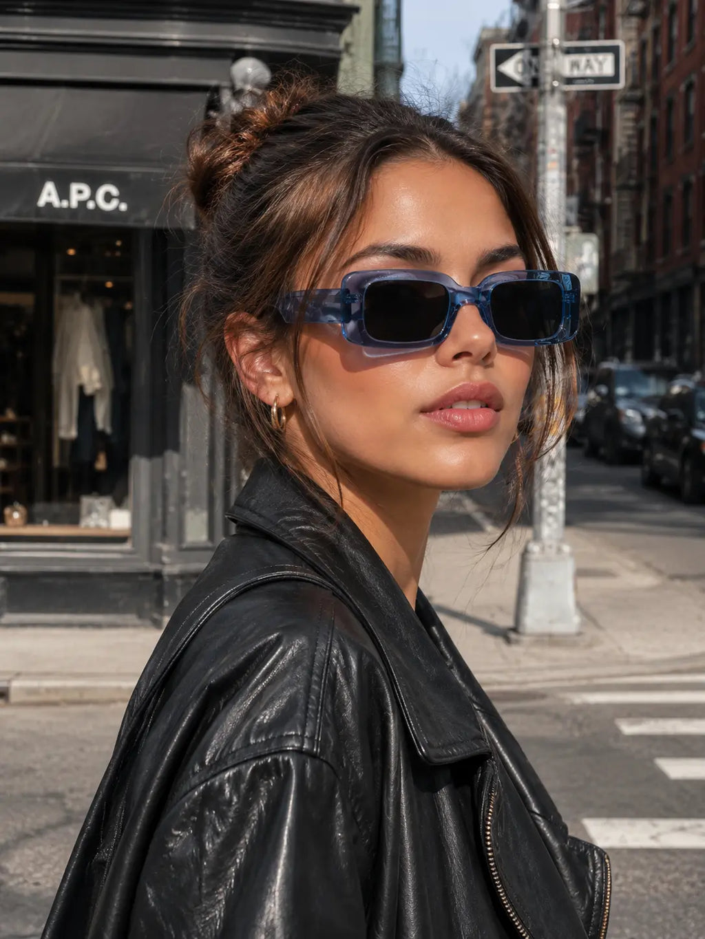 Model wearing Betty’s Retro Shades Penelope sunglasses in clear blue