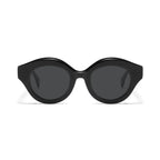 Betty’s Retro Shades Posey sunglasses in black with dark grey lenses