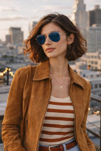 Model wearing Betty’s Retro Shades Renee sunglasses in rose gold