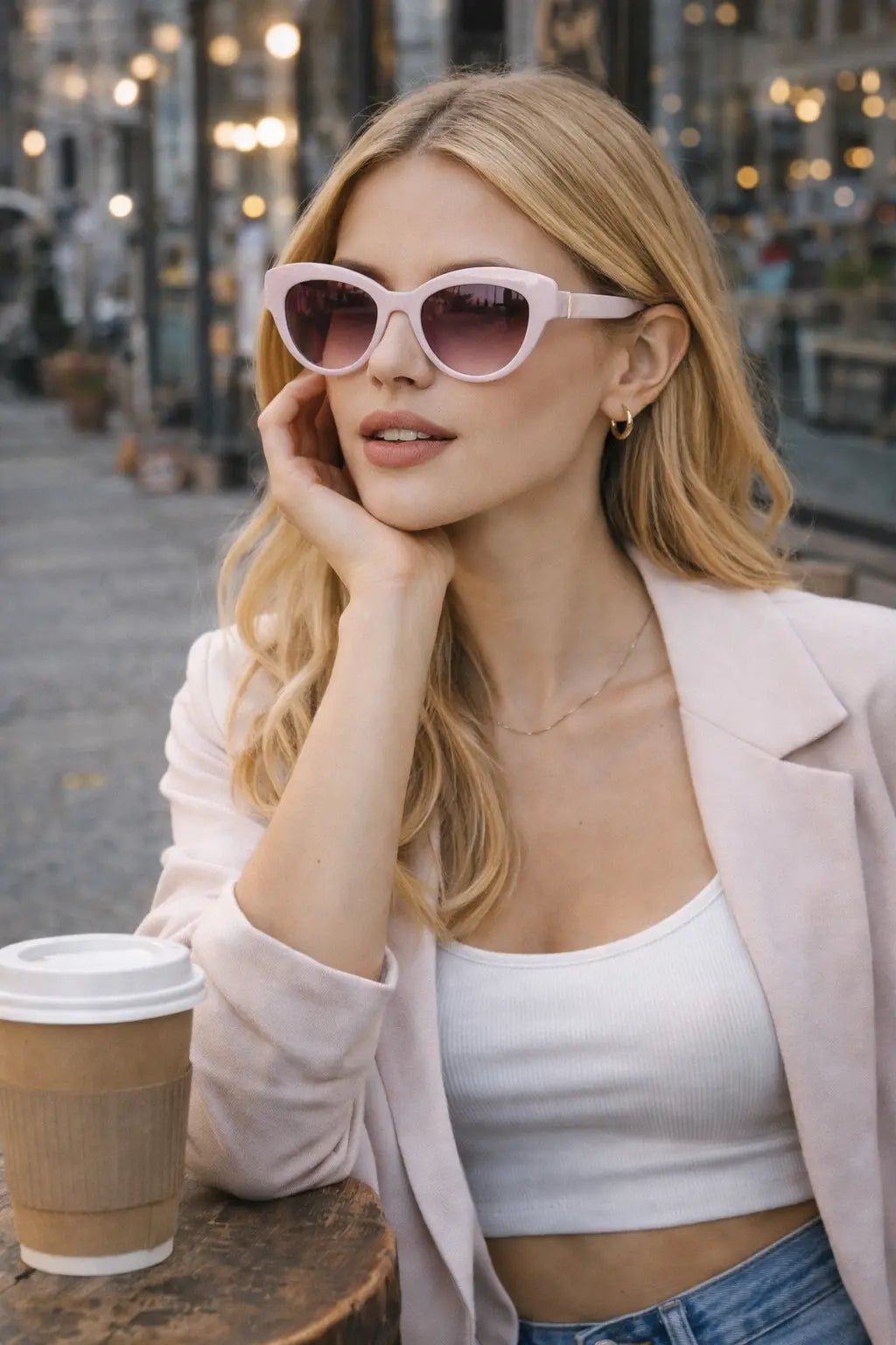 Model wearing Betty’s Retro Shades Sylvia sunglasses in pink